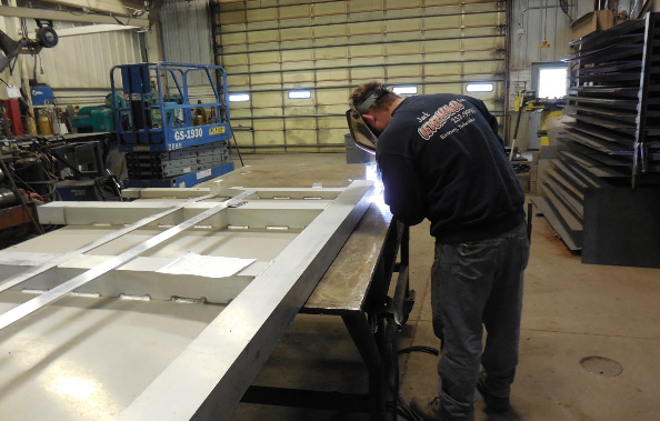 Welder at work on a steel frame